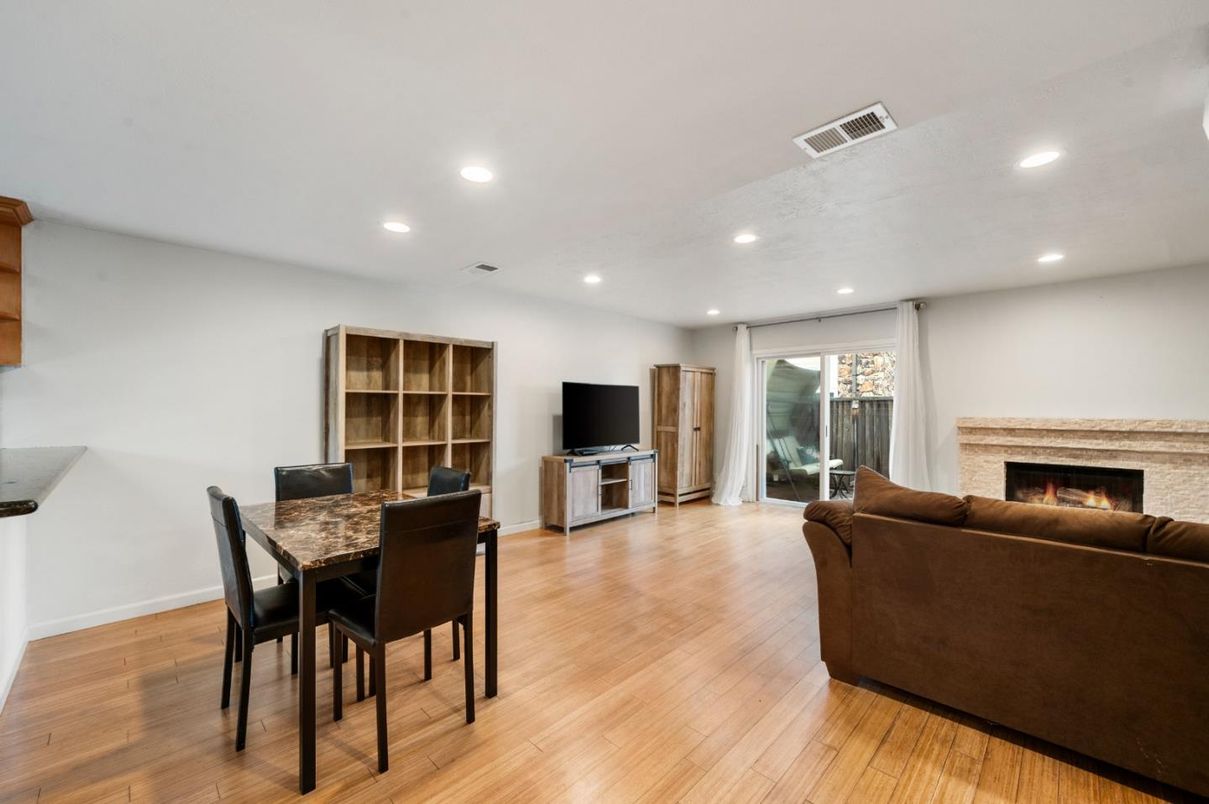 Dining room, Fireplace, Interior, Living room, Recessed Lighting, Wood Texture Flooring