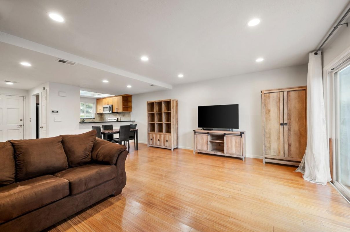 Dining room, Interior, Kitchen, Living room, Recessed Lighting, Stainless Steel Appliances, Wood Texture Flooring