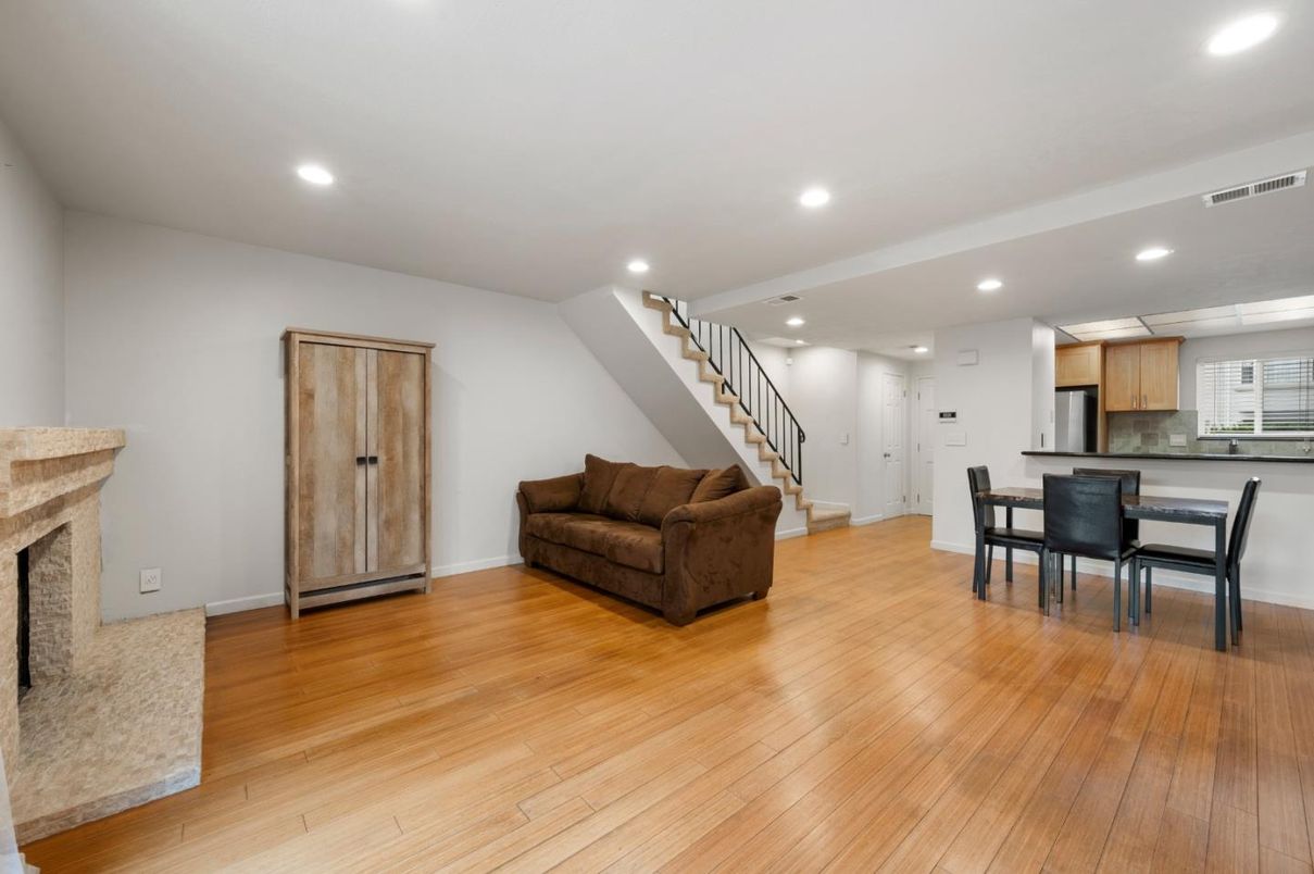 Dining room, Fireplace, Interior, Kitchen, Recessed Lighting, Wood Texture Flooring