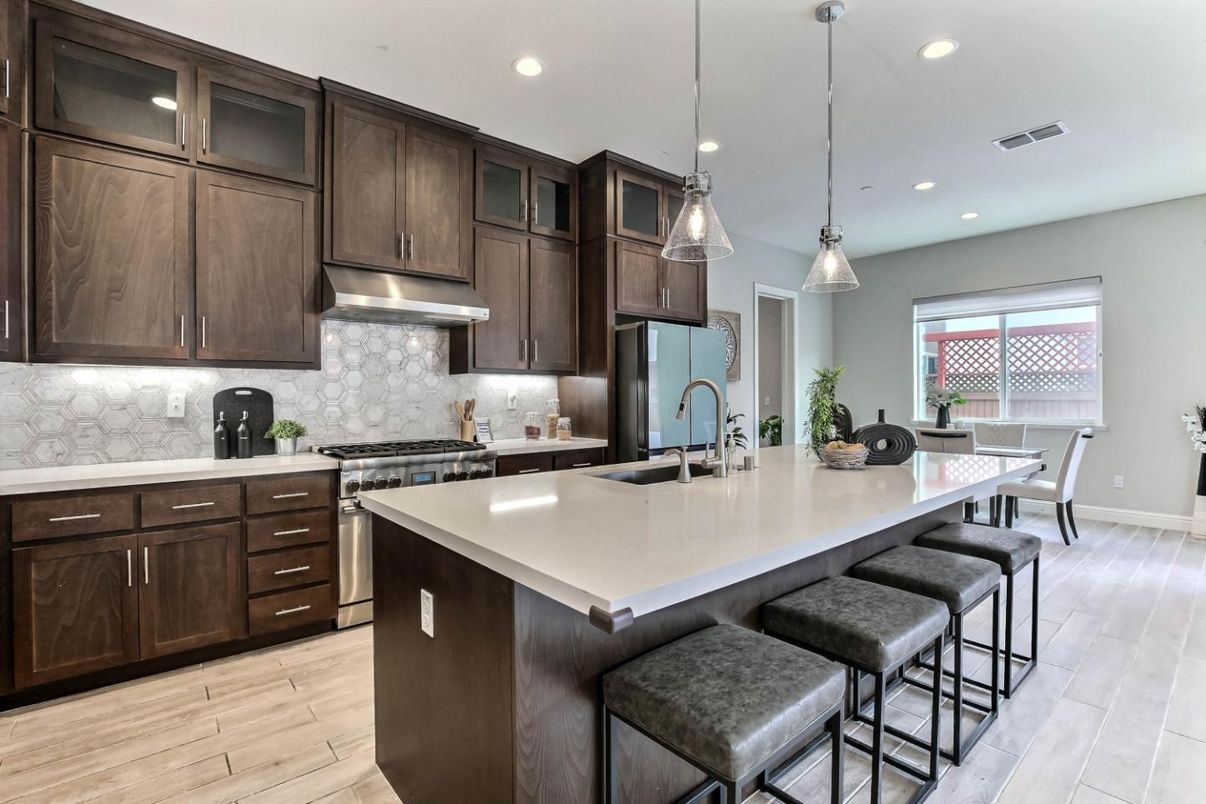 Dining room, Interior, Kitchen, Pendant Lights, Recessed Lighting, Stainless Steel Appliances, Wood Texture Flooring