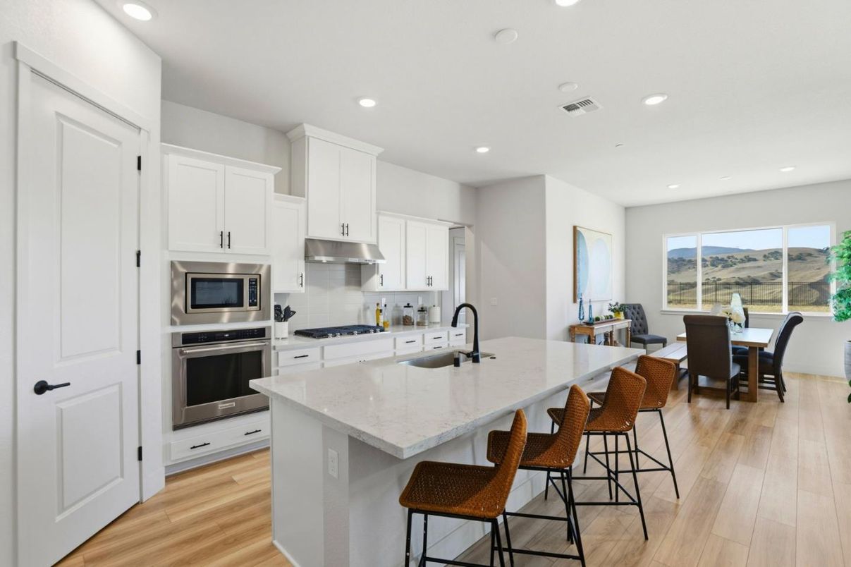Dining room, Interior, Kitchen, Recessed Lighting, Stainless Steel Appliances, Wood Texture Flooring
