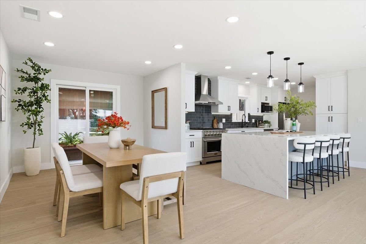 Dining room, Interior, Kitchen, Pendant Lights, Recessed Lighting, Stainless Steel Appliances, Wood Texture Flooring