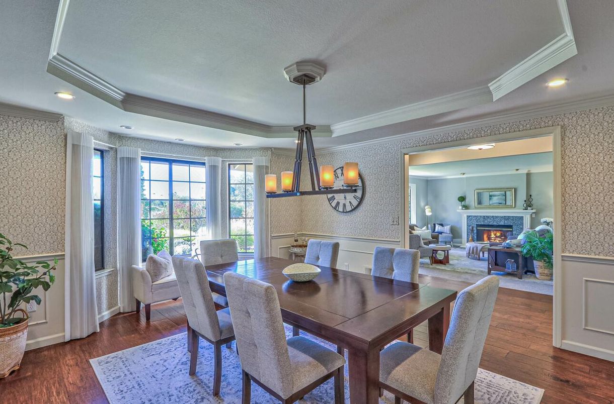 Chandelier, Dining room, Fireplace, Interior, Living room, Pendant Lights, Recessed Lighting, Wood Texture Flooring