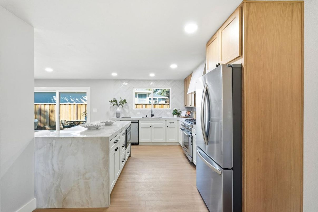 Interior, Kitchen, Marble Walls, Recessed Lighting, Stainless Steel Appliances, Wood Texture Flooring