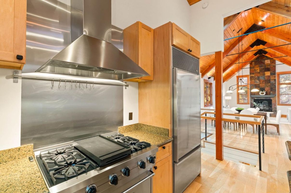 Dining room, Fireplace, Interior, Kitchen, Pendant Lights, Stainless Steel Appliances, Stone Walls, Wooden Beams, Wooden Ceilings, Wood Texture Flooring