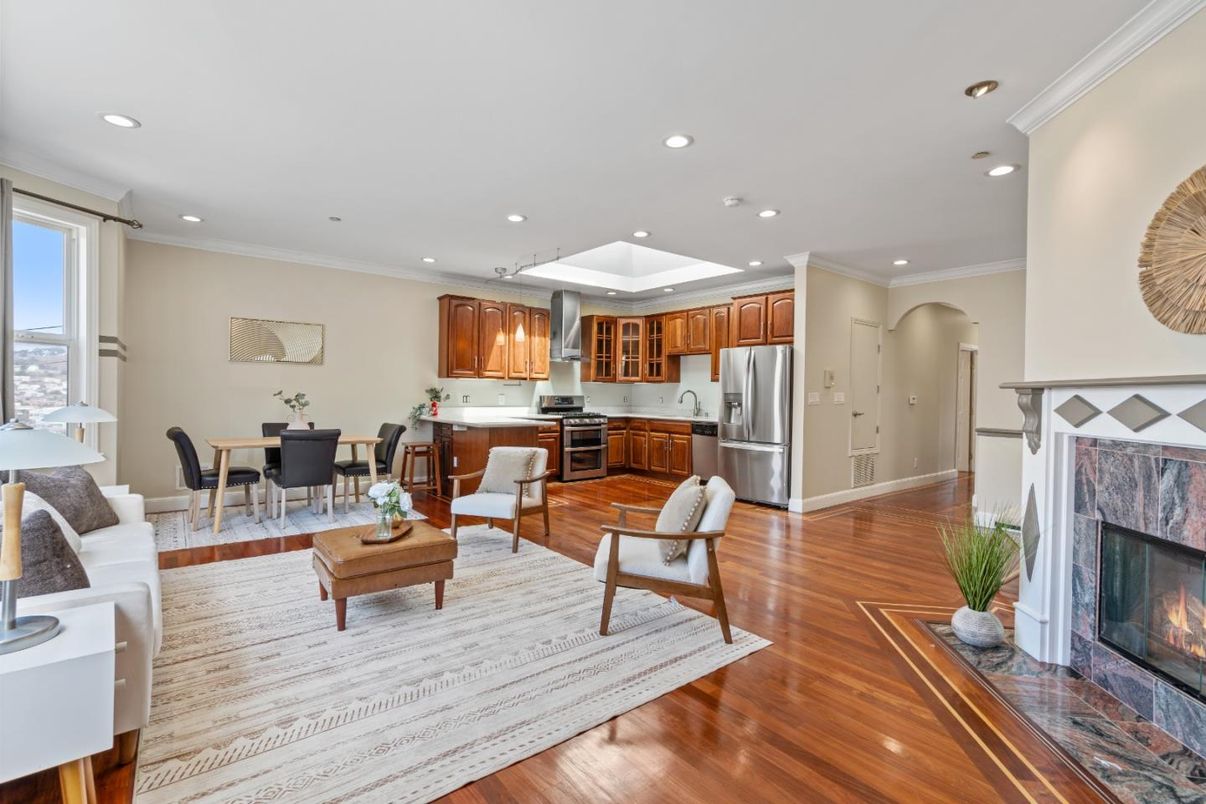 Dining room, Fireplace, Interior, Kitchen, Living room, Recessed Lighting, Stainless Steel Appliances, Wood Texture Flooring