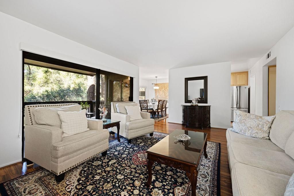 Chandelier, Dining room, Interior, Kitchen, Living room, Pendant Lights, Stainless Steel Appliances, Wood Texture Flooring