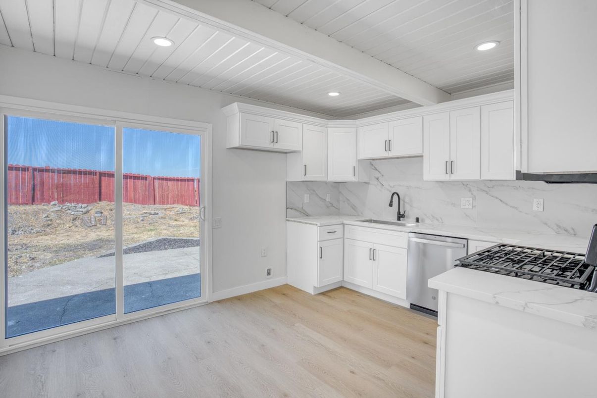 Interior, Kitchen, Marble Walls, Recessed Lighting, Stainless Steel Appliances, Wood Texture Flooring