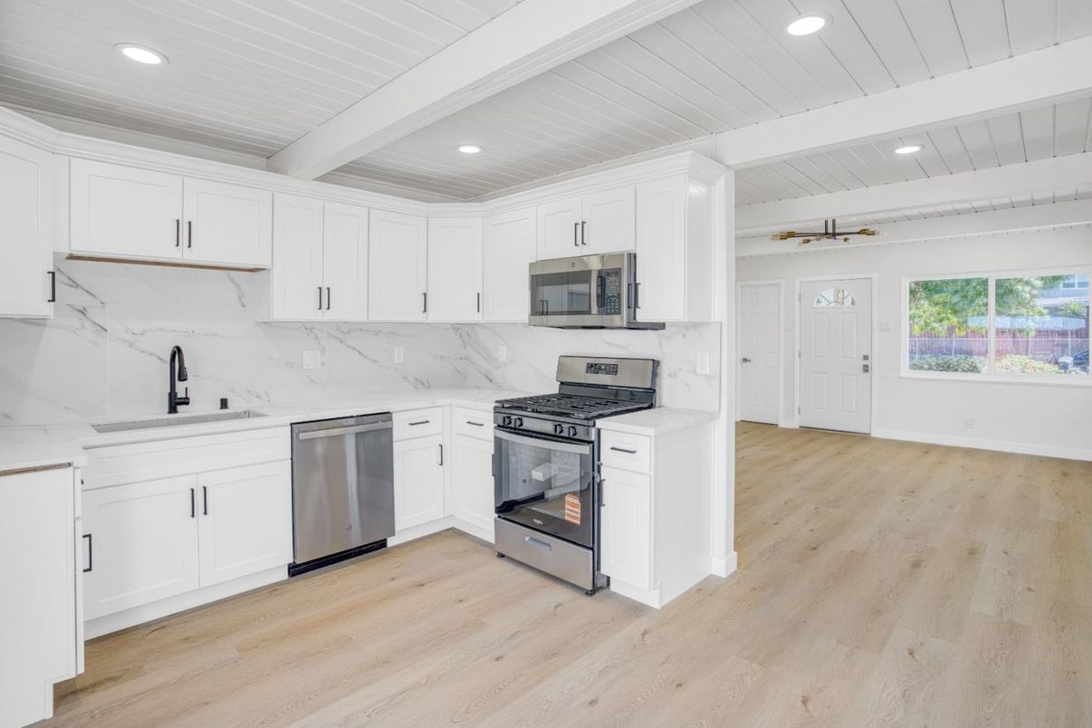 Interior, Kitchen, Marble Walls, Recessed Lighting, Stainless Steel Appliances, Wood Texture Flooring