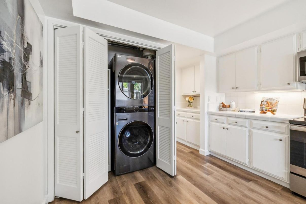 Interior, Kitchen, Tile Countertops, Utility Closets, Washer, Wood Texture Flooring