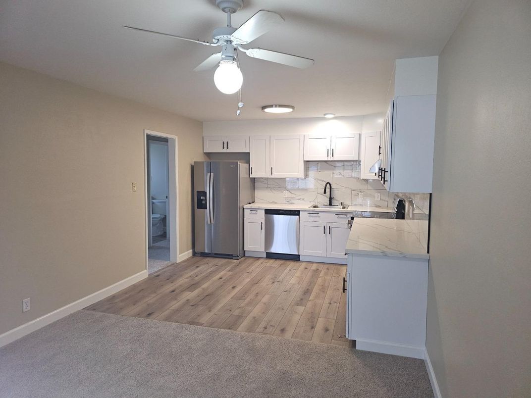 Interior, Kitchen, Marble Walls, Recessed Lighting, Stainless Steel Appliances, Wood Texture Flooring