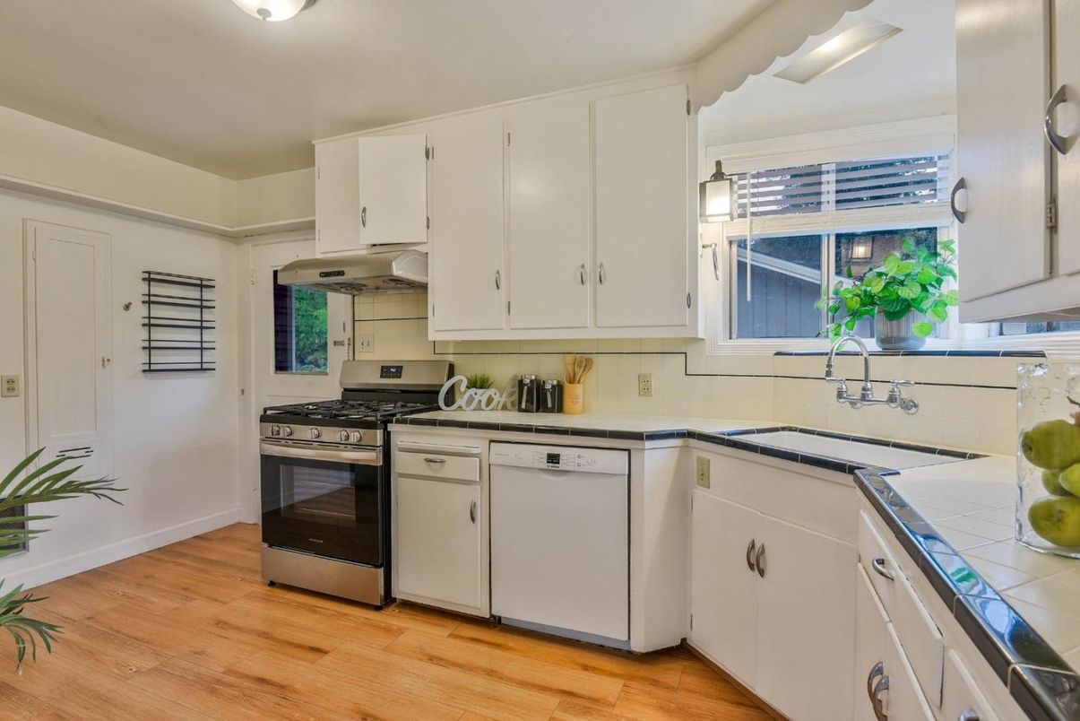 Interior, Kitchen, Stainless Steel Appliances, Tile Countertops, Wood Texture Flooring