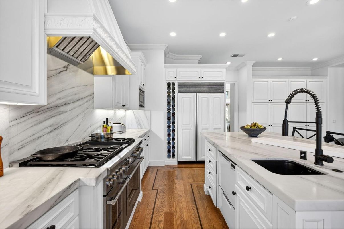 Interior, Kitchen, Marble Walls, Recessed Lighting, Stainless Steel Appliances, Wood Texture Flooring
