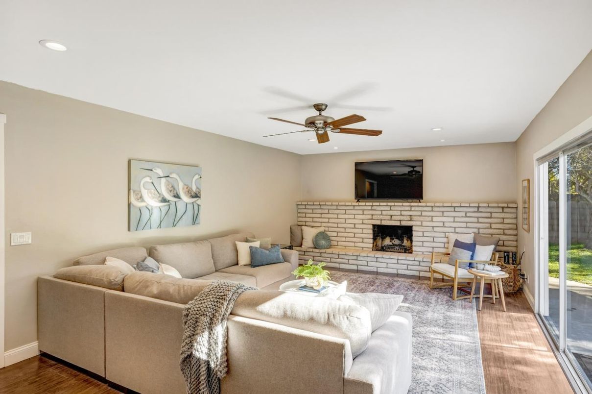 Fireplace, Interior, Living room, Recessed Lighting, Stone Walls, Wood Texture Flooring