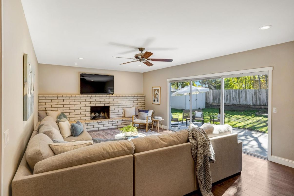 Fireplace, Interior, Living room, Recessed Lighting, Stone Walls, Wood Texture Flooring