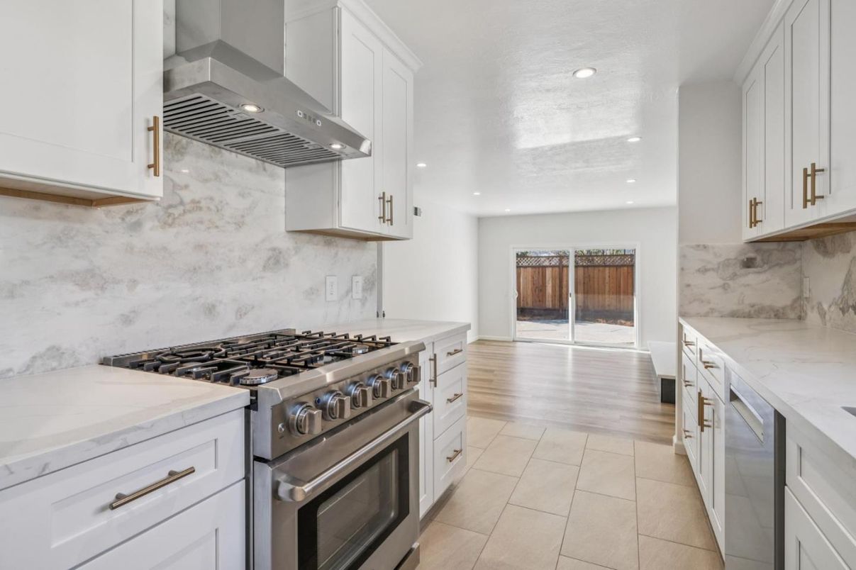 Interior, Kitchen, Marble Walls, Recessed Lighting, Stainless Steel Appliances, Wood Texture Flooring