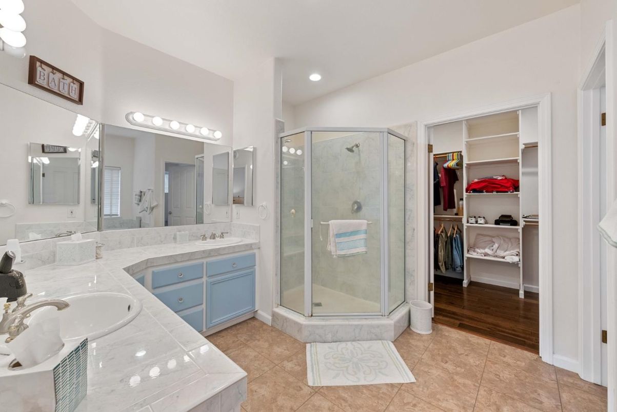 Bathroom, Dual Sink Vanities, Glass Shower, Interior, Recessed Lighting, Walk-in Closets, Wood Texture Flooring