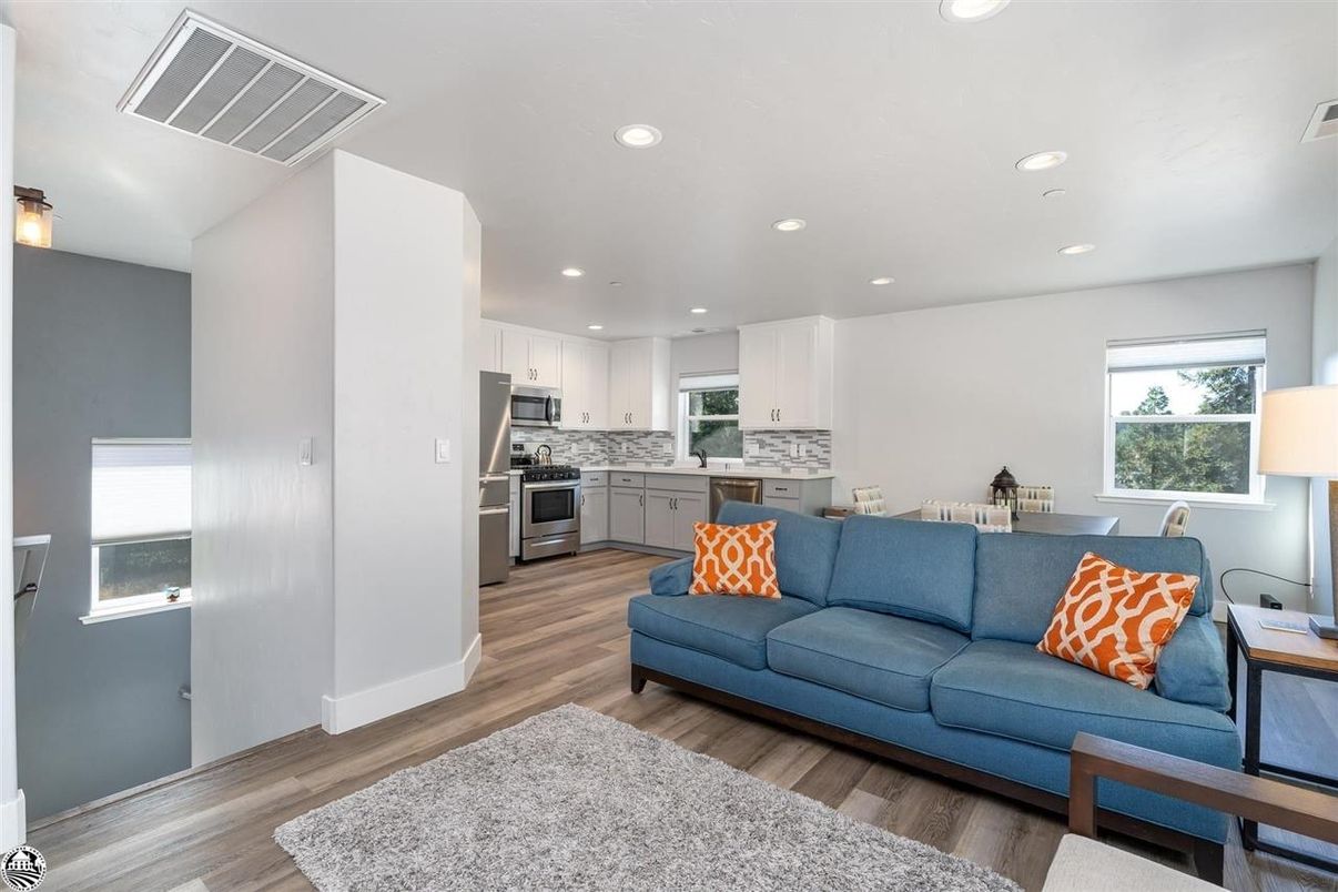 Dining room, Interior, Kitchen, Living room, Recessed Lighting, Stainless Steel Appliances, Wood Texture Flooring