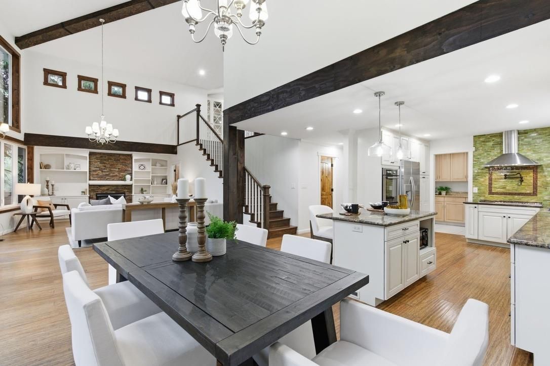 Chandelier, Dining room, Interior, Kitchen, Living room, Pendant Lights, Recessed Lighting, Stainless Steel Appliances, Wood Texture Flooring