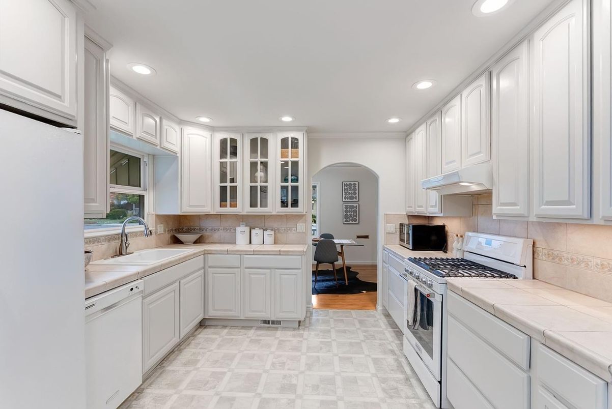 Interior, Kitchen, Recessed Lighting, Tile Countertops, Wood Texture Flooring