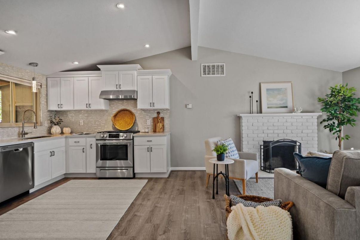 Fireplace, Interior, Kitchen, Living room, Pendant Lights, Recessed Lighting, Stainless Steel Appliances, Wood Texture Flooring