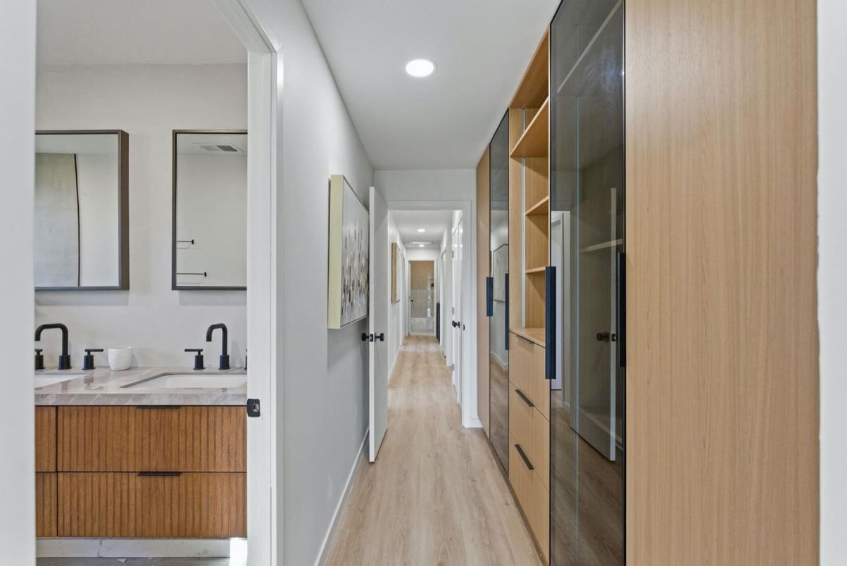 Bathroom, Dual Sink Vanities, Interior, Recessed Lighting, Walk-in Closets, Wood Texture Flooring