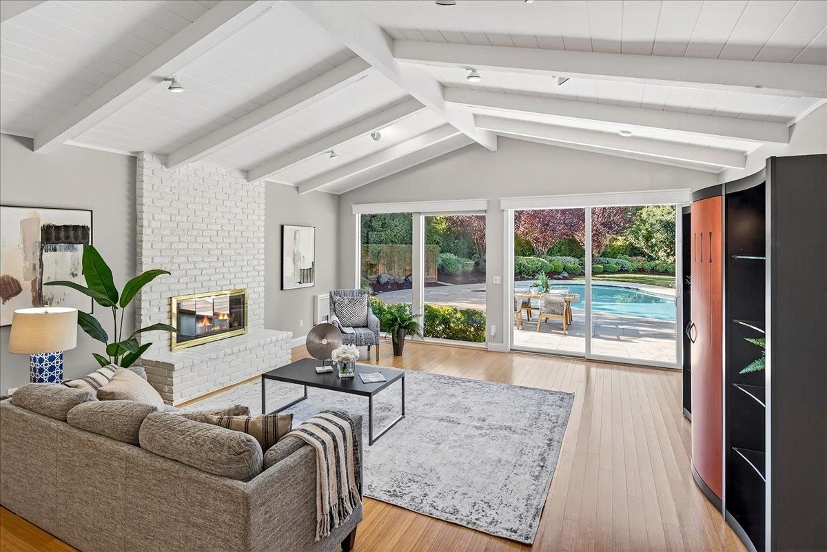 Fireplace, Interior, Living room, Recessed Lighting, Stone Walls, Wood Texture Flooring