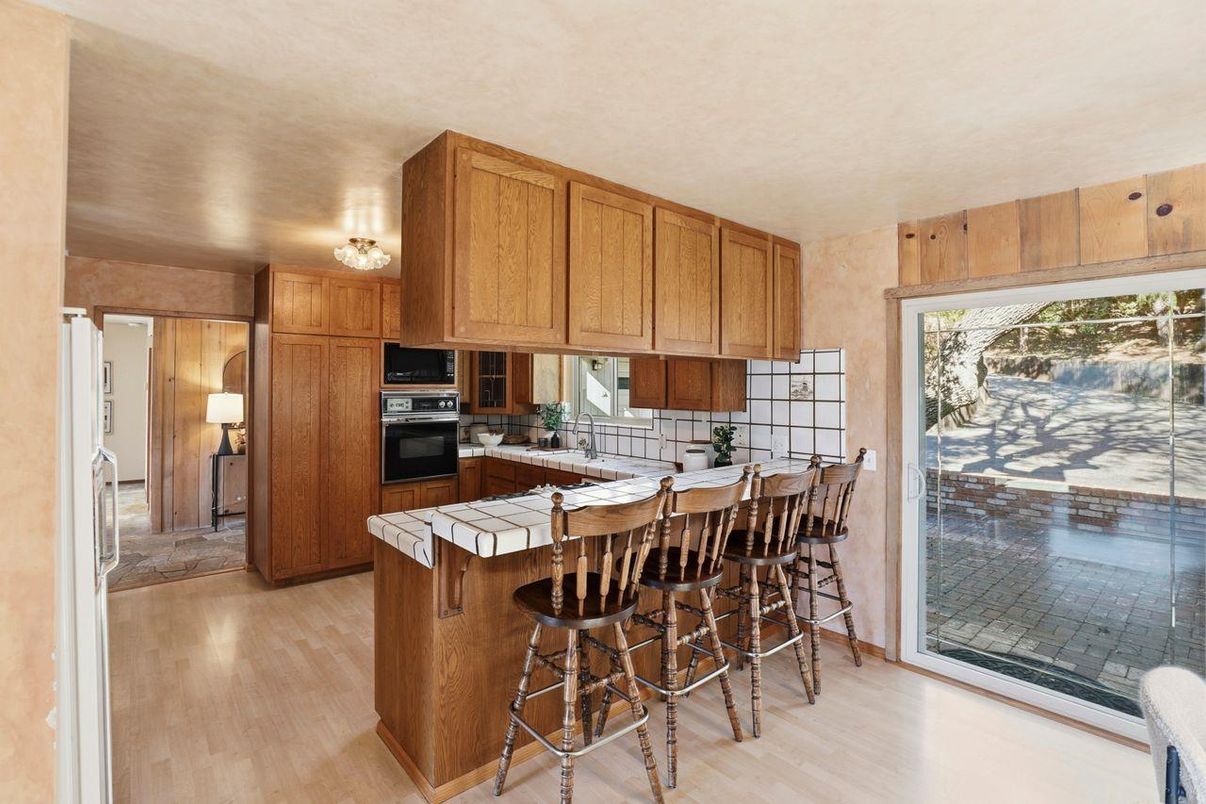 Interior, Kitchen, Stainless Steel Appliances, Tile Countertops, Wood Texture Flooring