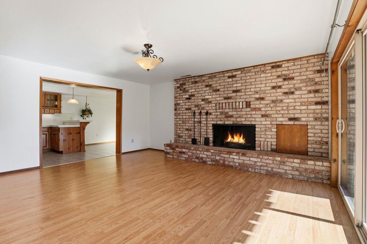 Empty room, Fireplace, Interior, Kitchen, Pendant Lights, Stone Walls, Wood Texture Flooring