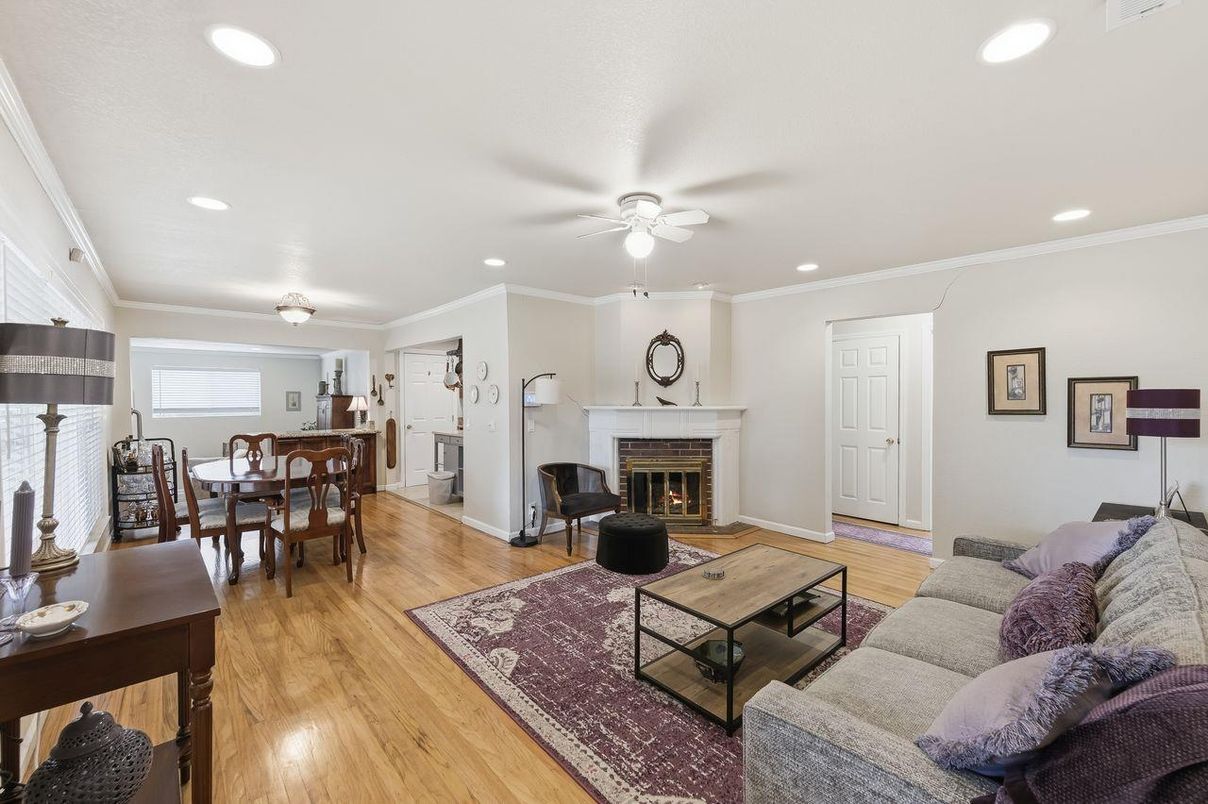 Dining room, Fireplace, Interior, Living room, Recessed Lighting, Wood Texture Flooring