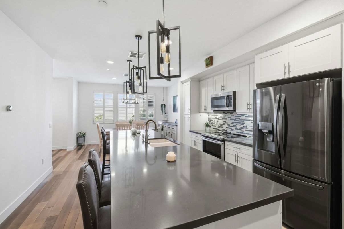 Dining room, Interior, Kitchen, Pendant Lights, Recessed Lighting, Stainless Steel Appliances, Wood Texture Flooring