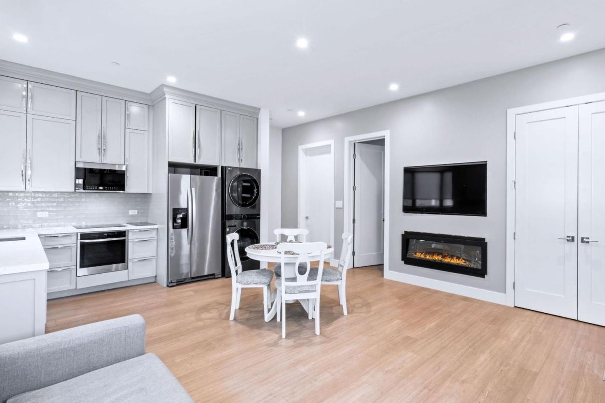 Dining room, Fireplace, Interior, Kitchen, Recessed Lighting, Stainless Steel Appliances, Wood Texture Flooring