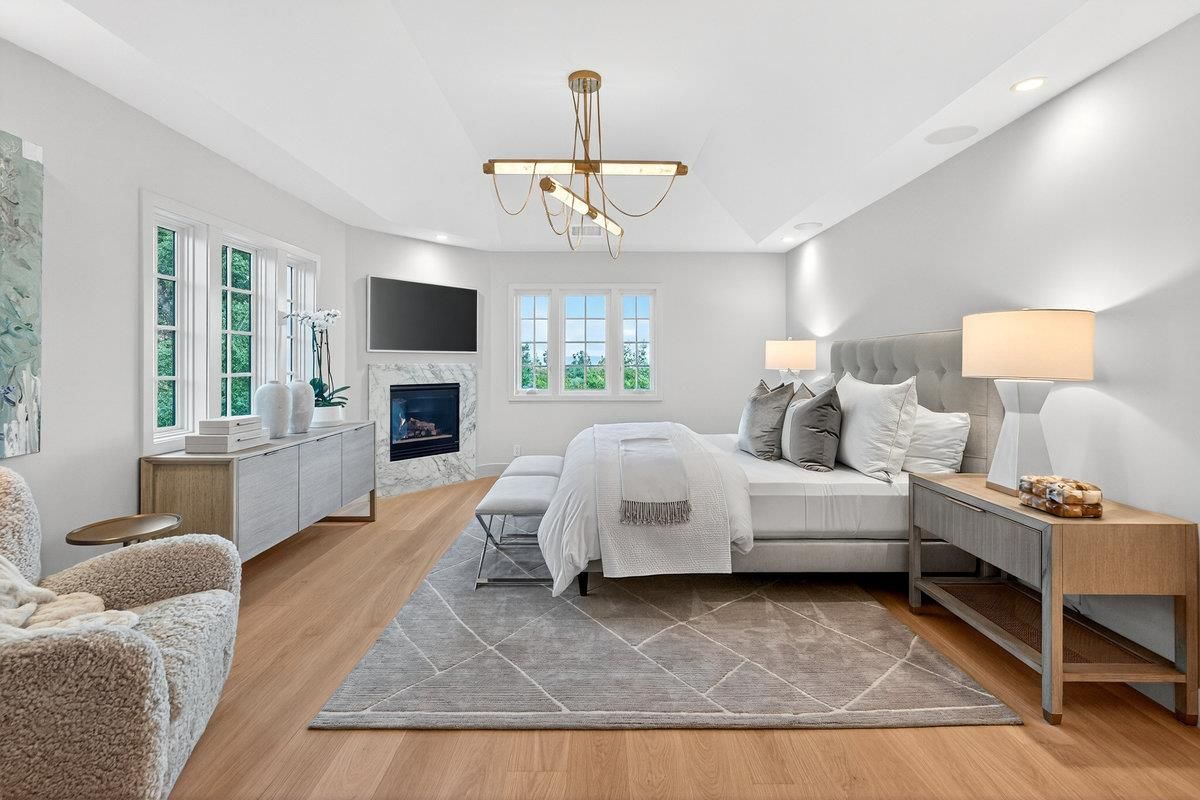 Bedroom, Chandelier, Fireplace, Interior, Recessed Lighting, Wood Texture Flooring