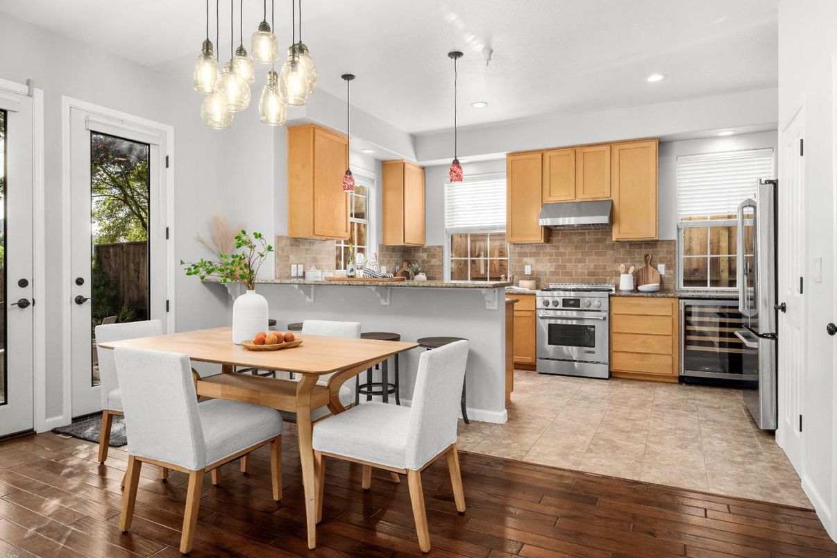 Dining room, Interior, Kitchen, Pendant Lights, Recessed Lighting, Stainless Steel Appliances, Wood Texture Flooring