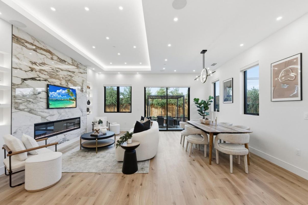 Dining room, Fireplace, Interior, Living room, Marble Walls, Pendant Lights, Recessed Lighting, Wood Texture Flooring