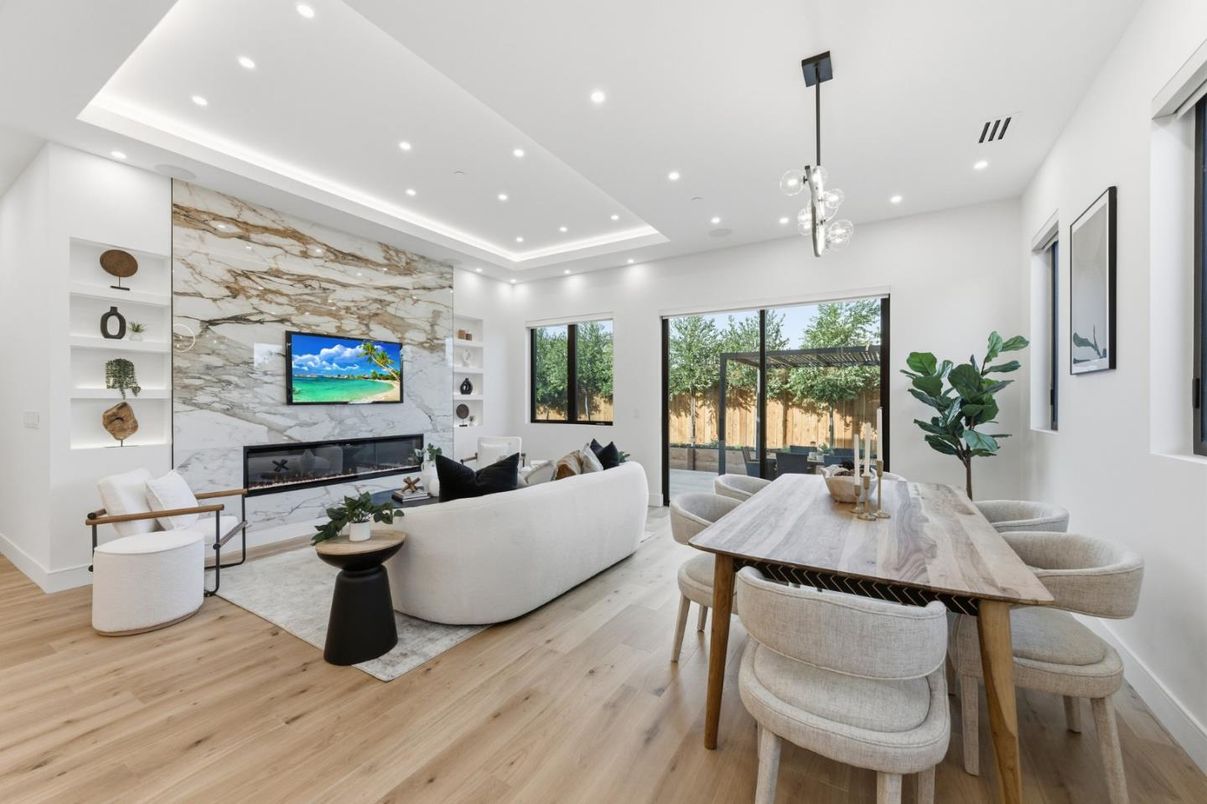 Dining room, Fireplace, Interior, Living room, Marble Walls, Pendant Lights, Recessed Lighting, Wood Texture Flooring