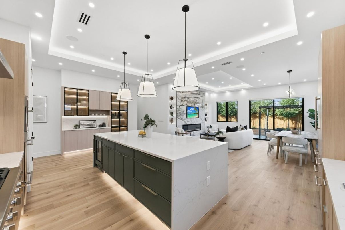 Dining room, Fireplace, Interior, Kitchen, Living room, Pendant Lights, Recessed Lighting, Stainless Steel Appliances, Wood Texture Flooring