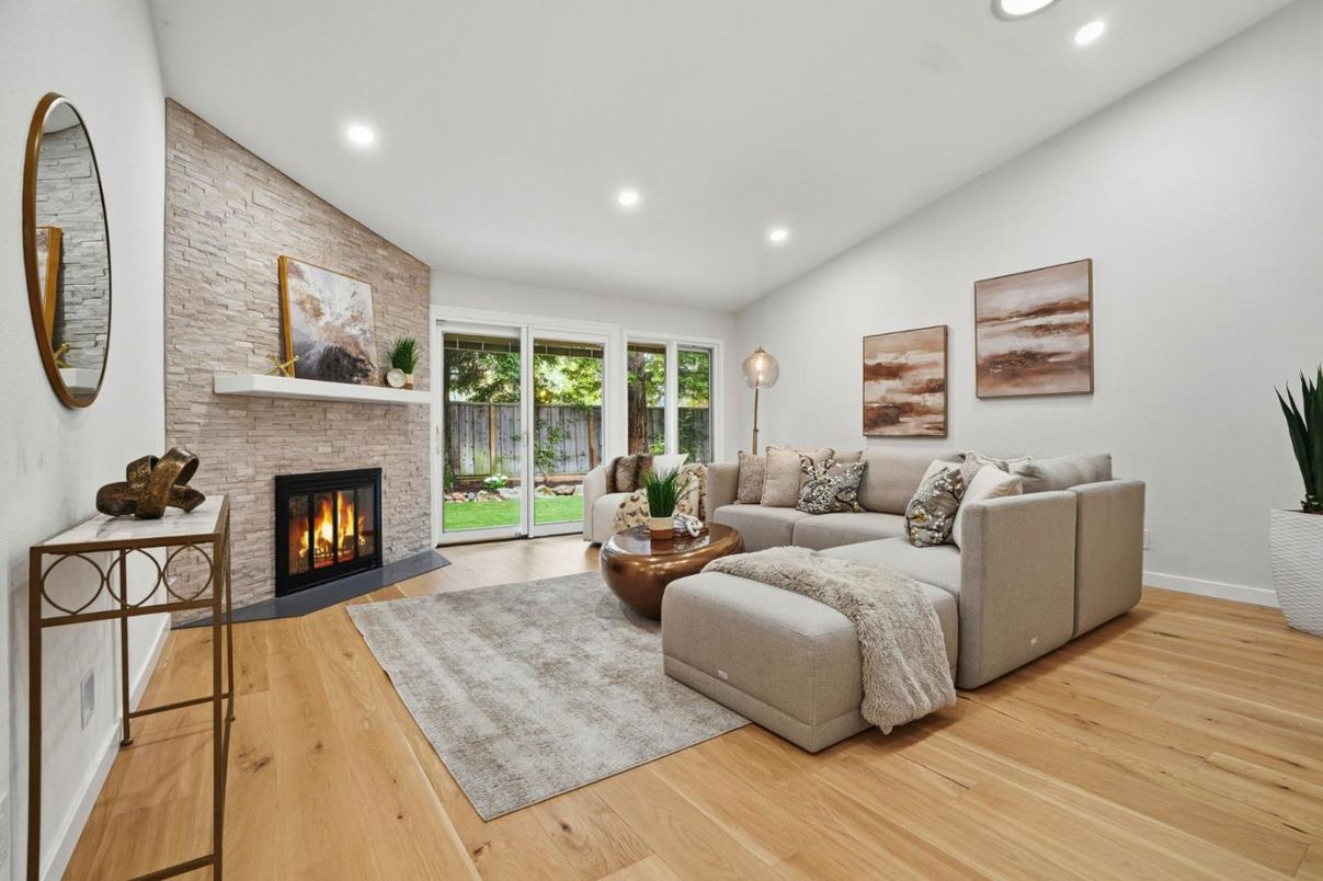 Fireplace, Interior, Living room, Recessed Lighting, Stone Walls, Wood Texture Flooring