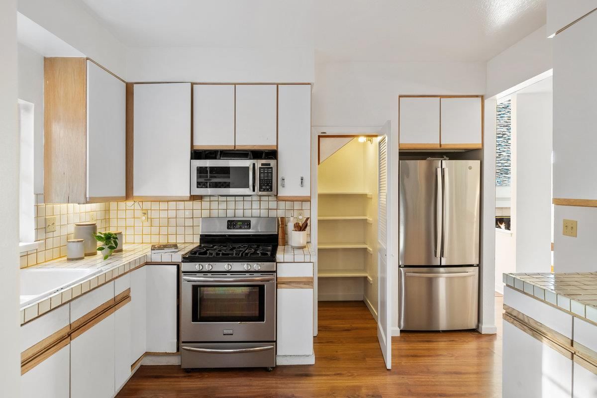 Interior, Kitchen, Stainless Steel Appliances, Tile Countertops, Wood Texture Flooring