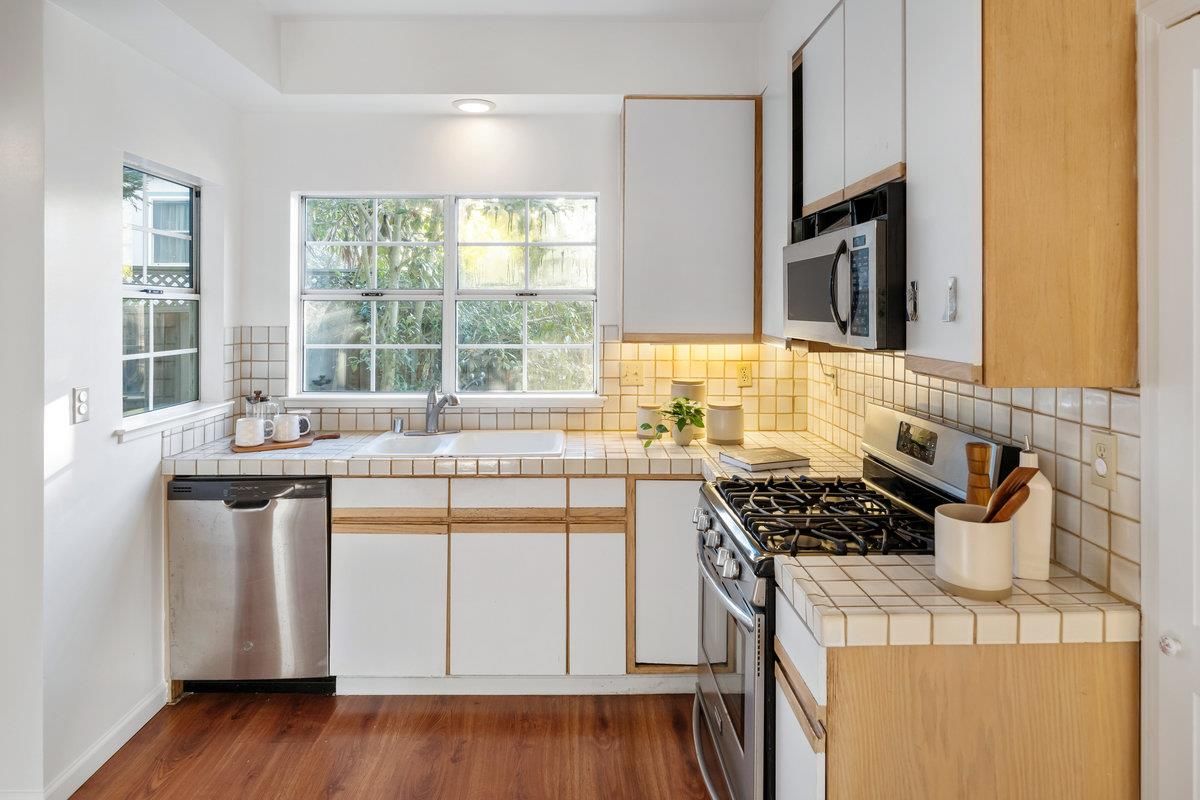 Interior, Kitchen, Recessed Lighting, Stainless Steel Appliances, Tile Countertops, Wood Texture Flooring