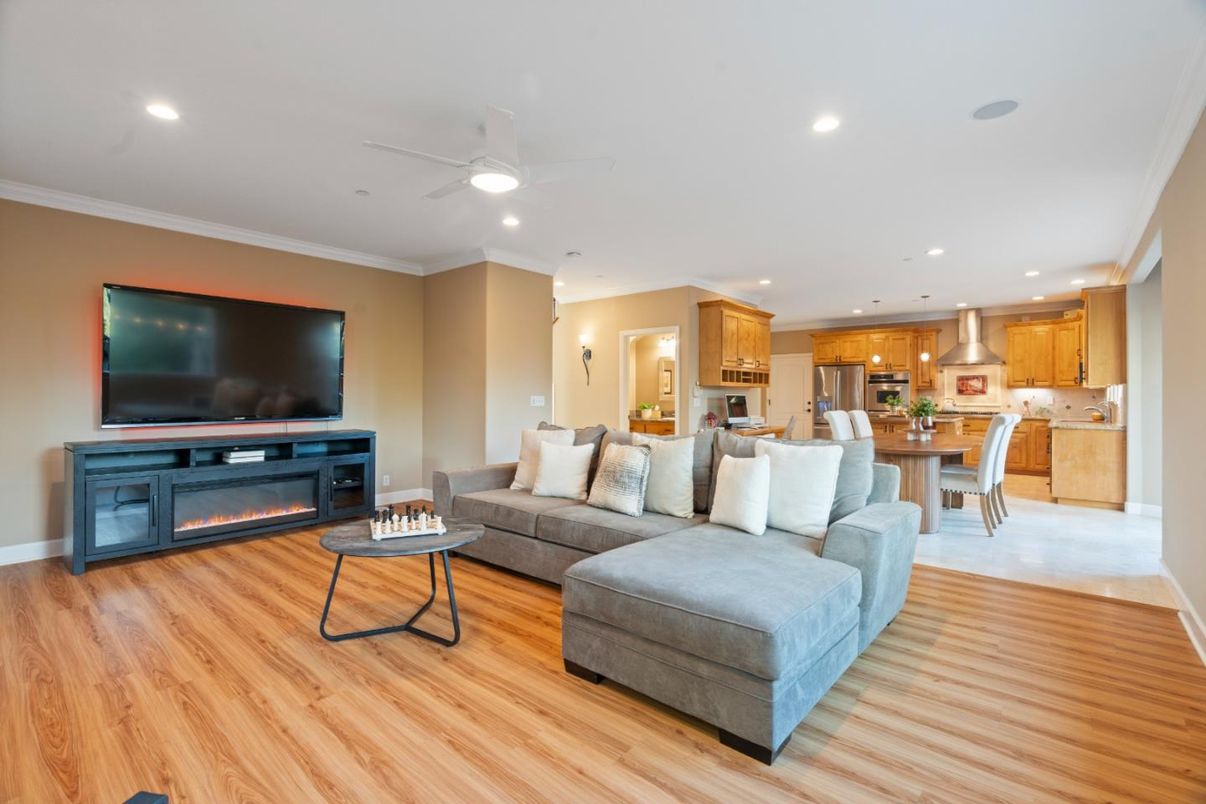 Dining room, Fireplace, Interior, Kitchen, Living room, Recessed Lighting, Stainless Steel Appliances, Wood Texture Flooring