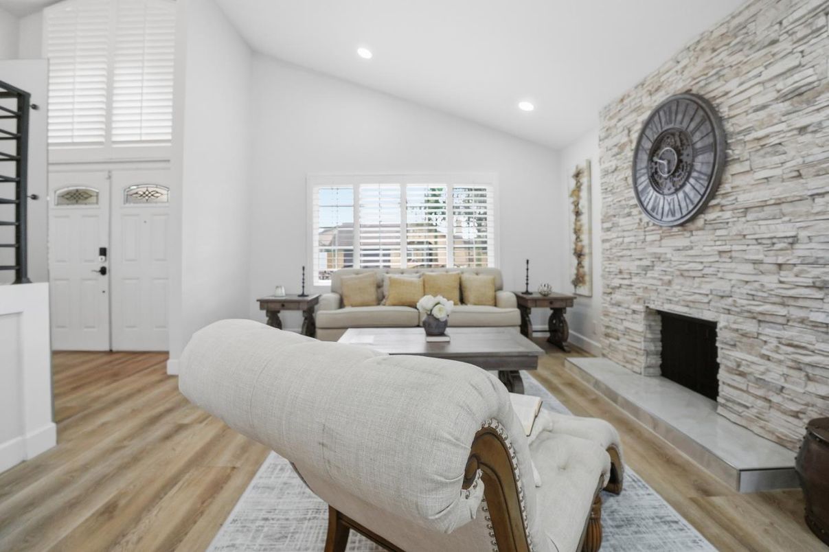 Fireplace, Interior, Living room, Recessed Lighting, Stone Walls, Wood Texture Flooring