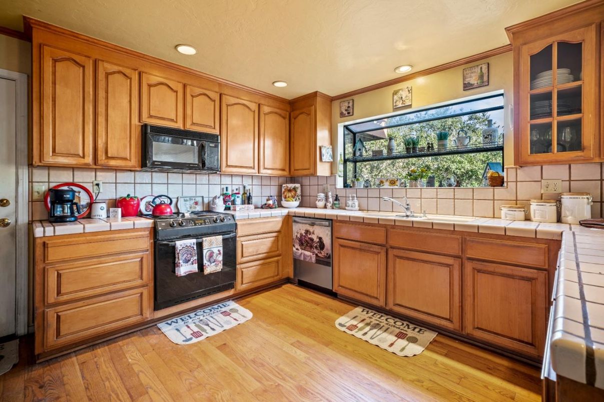 Interior, Kitchen, Recessed Lighting, Tile Countertops, Wood Texture Flooring