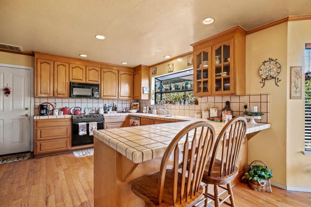 Interior, Kitchen, Recessed Lighting, Tile Countertops, Wood Texture Flooring