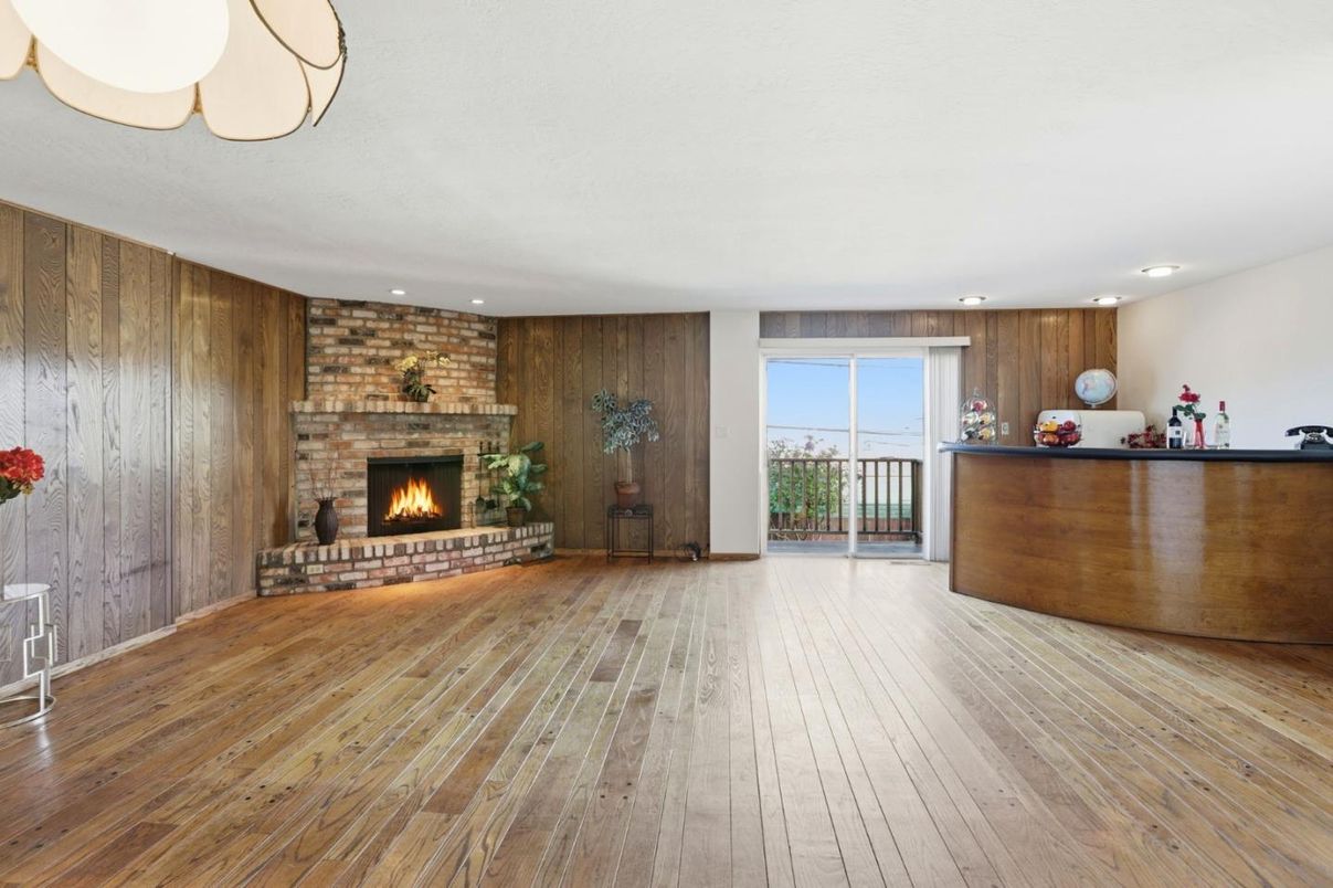 Empty room, Fireplace, Interior, Recessed Lighting, Stone Walls, Wood Texture Flooring, Wooden Walls