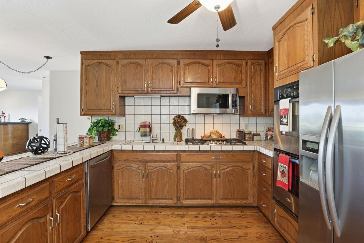 Interior, Kitchen, Stainless Steel Appliances, Tile Countertops, Wood Texture Flooring