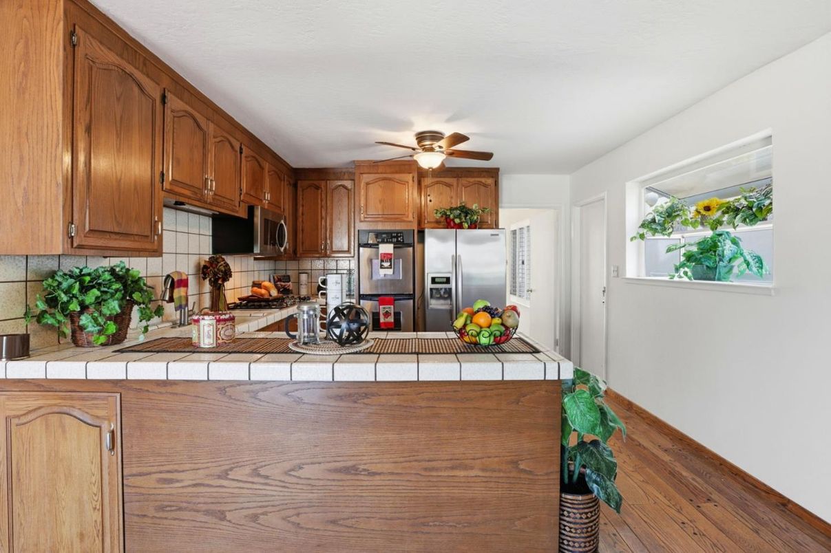 Interior, Kitchen, Tile Countertops, Wood Texture Flooring