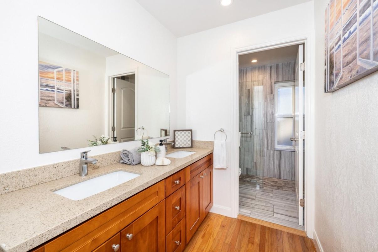 Bathroom, Dual Sink Vanities, Glass Shower, Interior, Recessed Lighting, Wood Texture Flooring