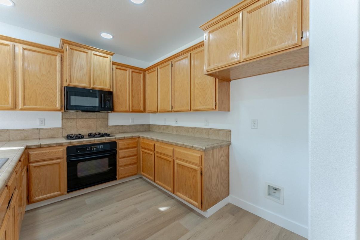 Interior, Kitchen, Recessed Lighting, Tile Countertops, Wood Texture Flooring