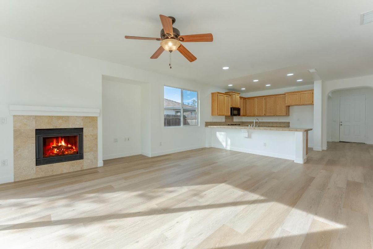 Empty room, Fireplace, Interior, Kitchen, Recessed Lighting, Wood Texture Flooring